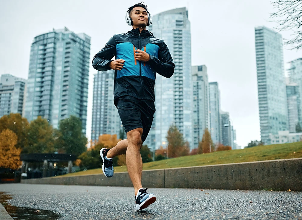 man running with headphones | CA Aesthetics by Dr. Li